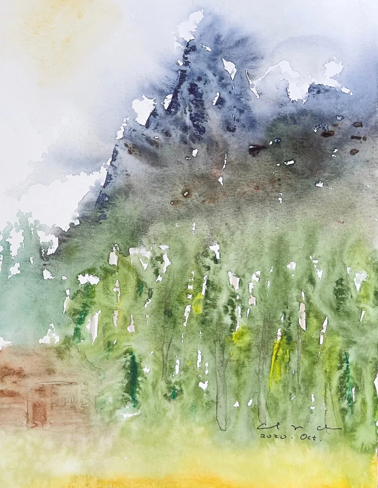 Watercolour of a dark grey mountain peak in mist above a forest of tall green trees and yellow meadow.